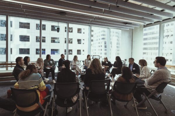 Photo shows a discussion between attendees at the MTM Forum at Sephora