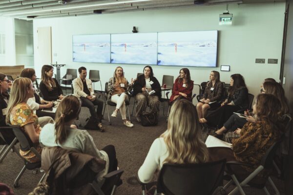 Photo shows a discussion between attendees at the MTM Forum at Sephora