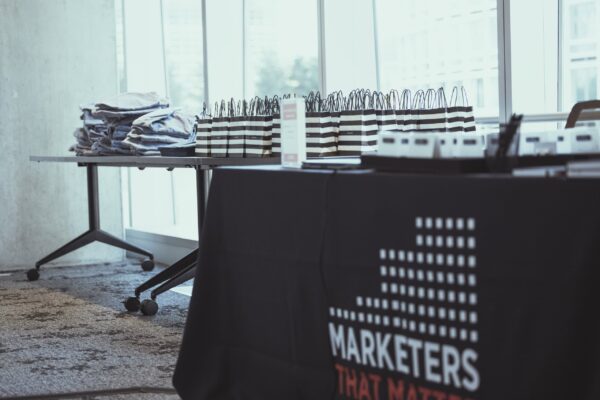 Photo shows Marketers That Matter merch table